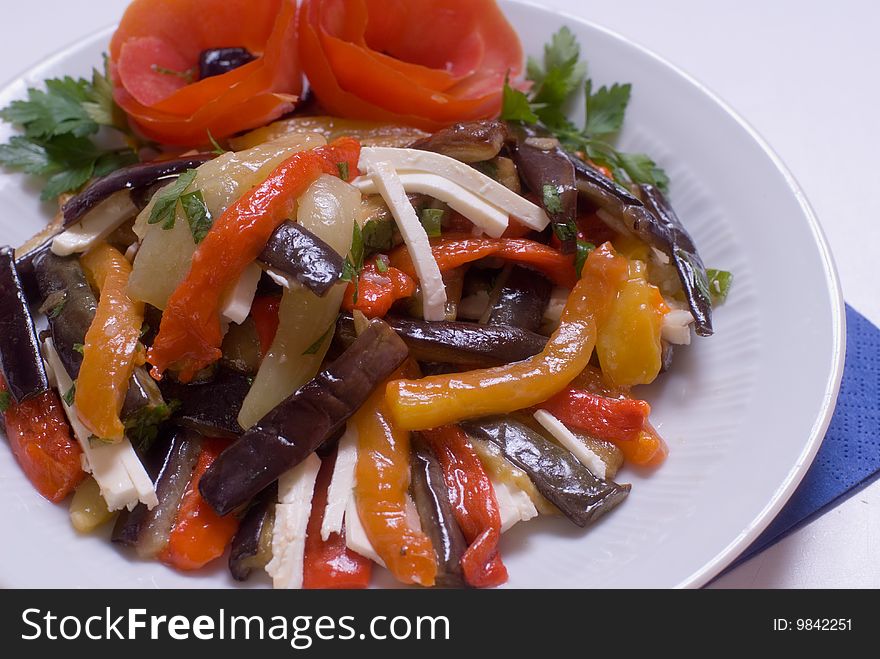 Salad of braised eggplant with pepper, filled cheese and oil. Salad of braised eggplant with pepper, filled cheese and oil