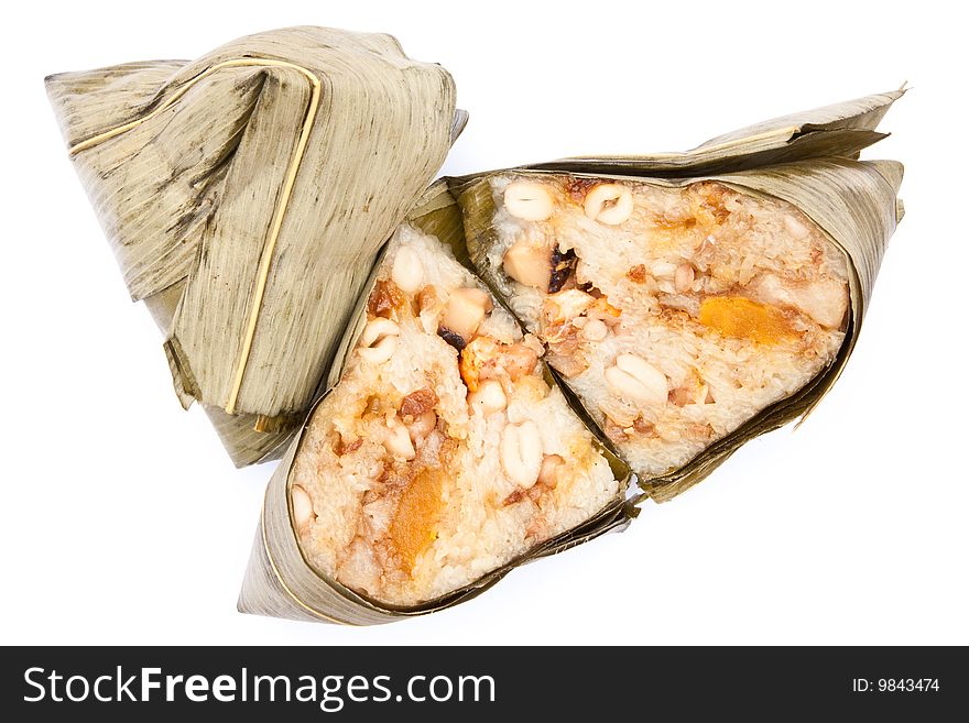 Traditional Chinese food, made from rice, nut, vegetable, salted egg, mushroom, pork, pepper, garlic and other spices. Bundled with natural native leaf and boil. Chinese people called it 'Ba Jang'.