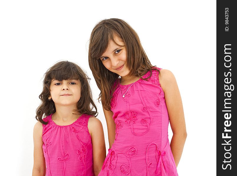 Two cute little girls posing. Two cute little girls posing