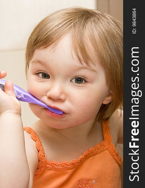 Sweet toddler baby girl cleaning teeth. Sweet toddler baby girl cleaning teeth