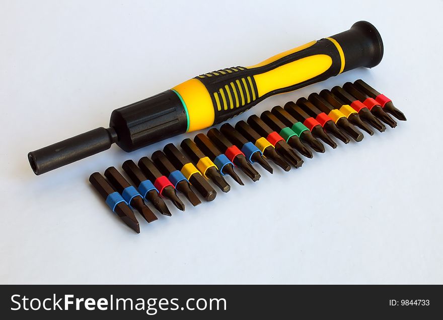 Row of Screwdrivers closeup isolated on gray background