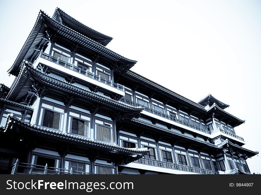 A ancient temple made out of wood in selenium tone