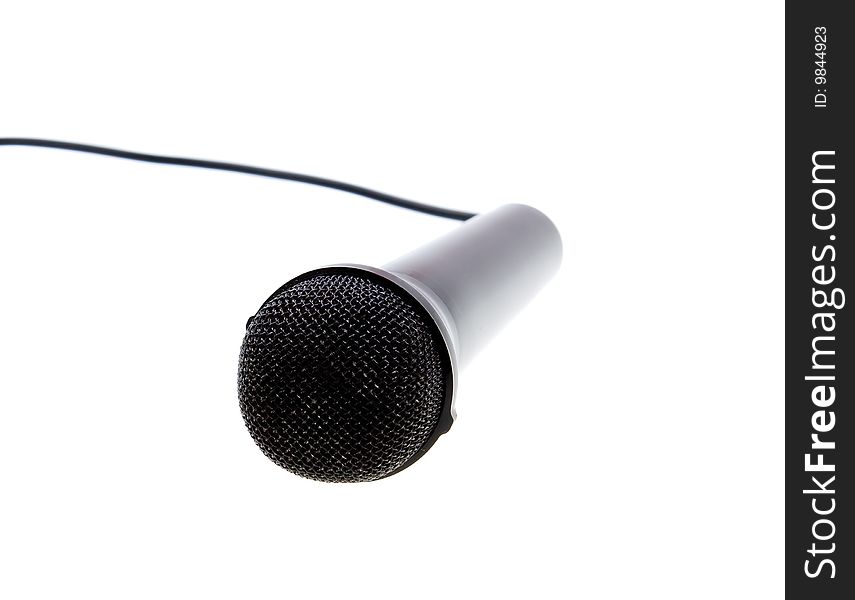 Black microphone with cable isolated over white. Black microphone with cable isolated over white
