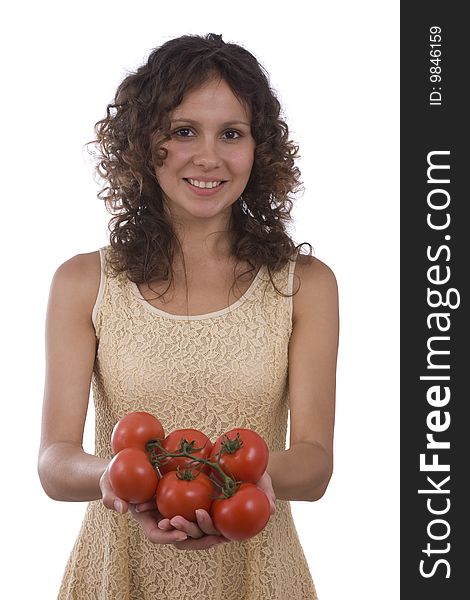 Pretty smiling woman holding branch of red tomatoes. Isolated over white background. Beautiful girl with fresh vegetables. Pretty smiling woman holding branch of red tomatoes. Isolated over white background. Beautiful girl with fresh vegetables