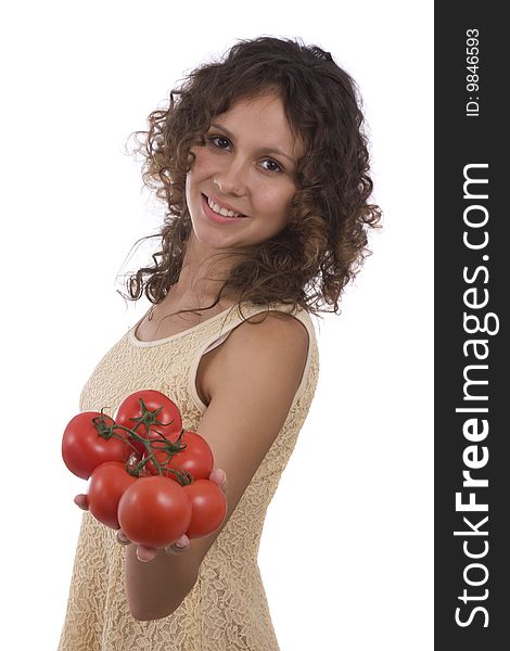 Smiling woman holding branch of red tomatoes