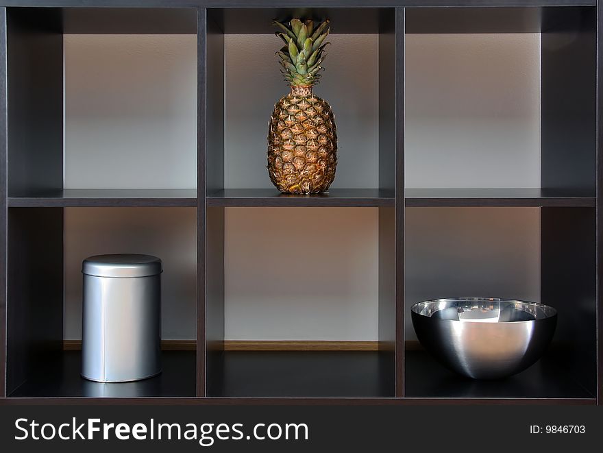 Ananas,can and bowl in a black box. Ananas,can and bowl in a black box