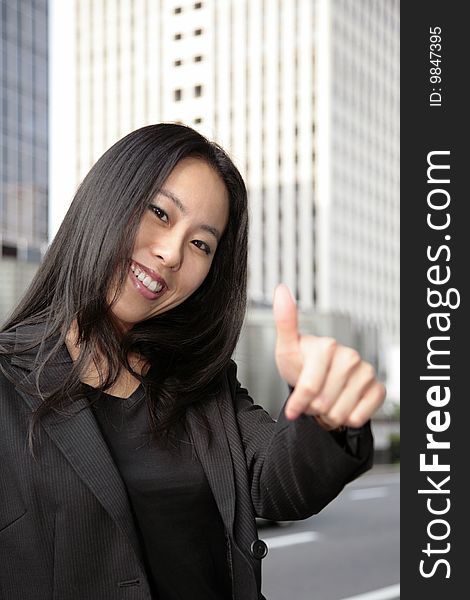 A business woman with her thumb up, more of this model in my portfolio.