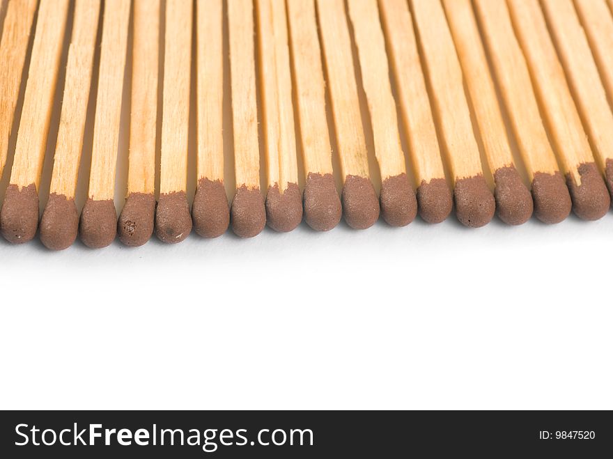 Closeup wooden matchsticks with copyspace isolated