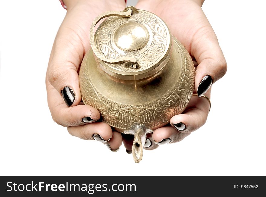 Female hands holding holy vessel on white background.