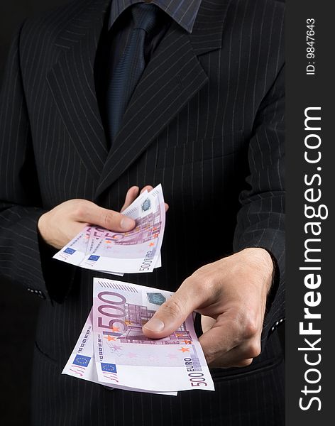 Businessman Holding Euros