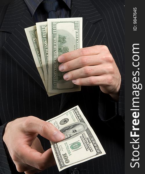 Businessman with hand full of money. Businessman with hand full of money