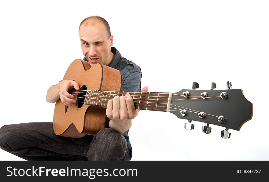 Man playing acoustic guitar isolated on white