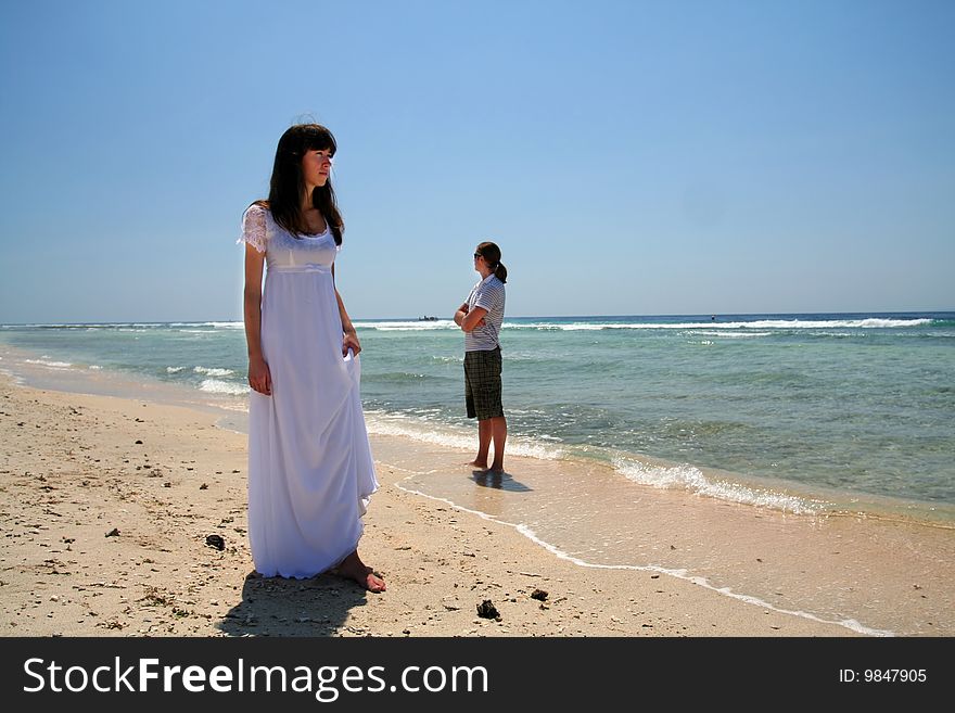 Photo of just married couple taken on the beach of Indian ocean. Photo of just married couple taken on the beach of Indian ocean