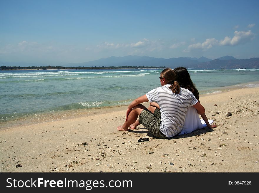 Photo of just married couple taken on the beach of Indian ocean. Photo of just married couple taken on the beach of Indian ocean