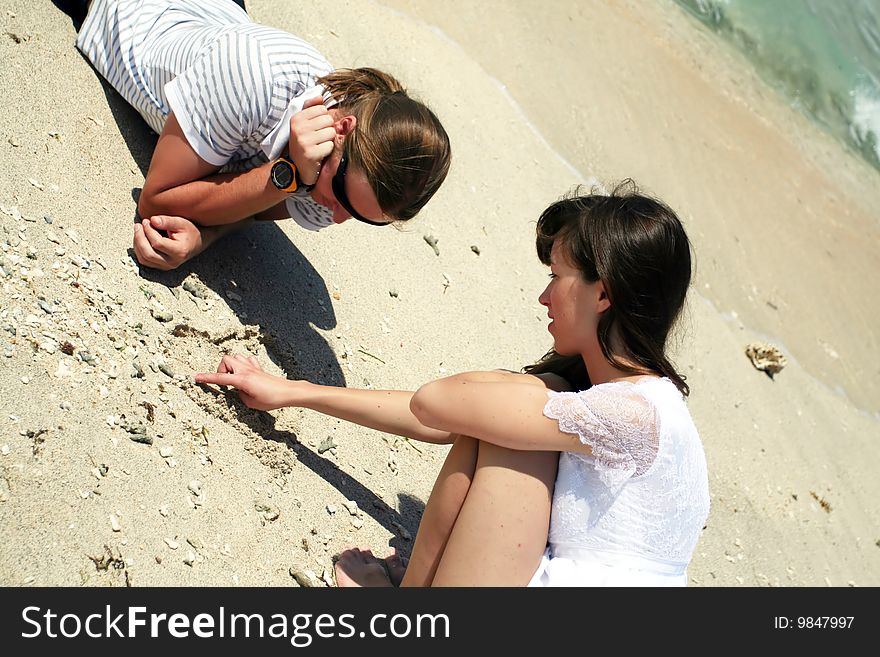 Photo of just married couple taken on the beach of Indian ocean. Photo of just married couple taken on the beach of Indian ocean