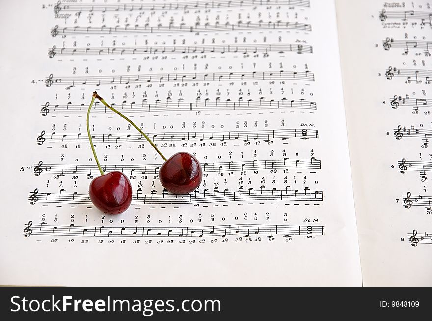 Two Sweet Cherries And Notes Book.