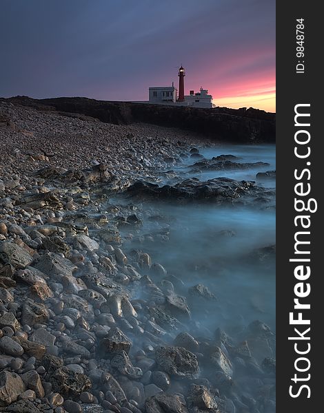 The long exposition creates a line and along with the shine of the rocks guide us until Raso Cape lighthouse.