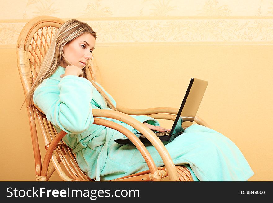 Beautiful young woman with a laptop at home. Beautiful young woman with a laptop at home.