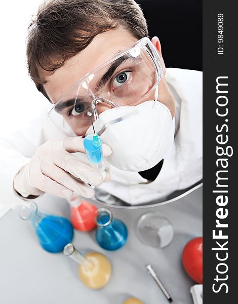 Medical theme: serious doctor working in a laboratory. Medical theme: serious doctor working in a laboratory.