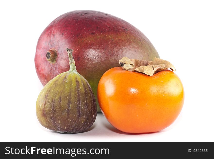 A small group of tropical fruits (consisting of mango, fig and sharon fruit) isolated on a white background