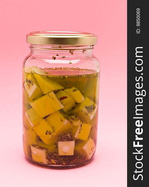 Bottle with goat cheese in olive oil
photography studio, foreground