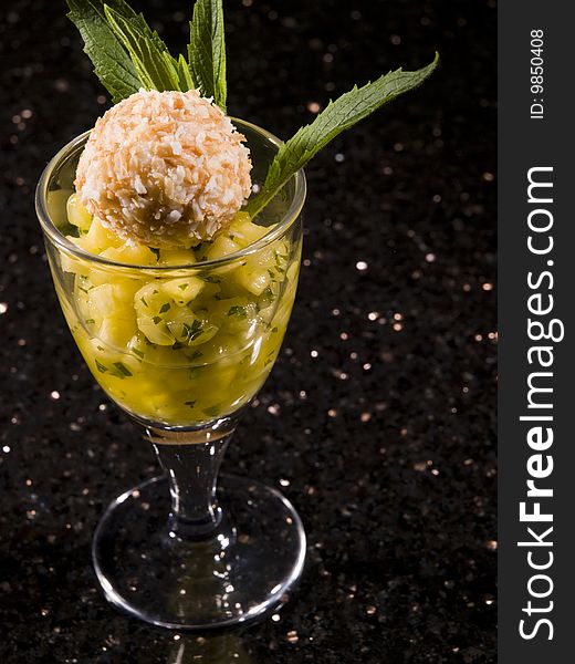 Creative dessert with pineapple,ice cream and menthe. Creative dessert with pineapple,ice cream and menthe