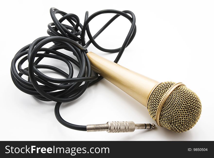 Old golden microphone with a black wire