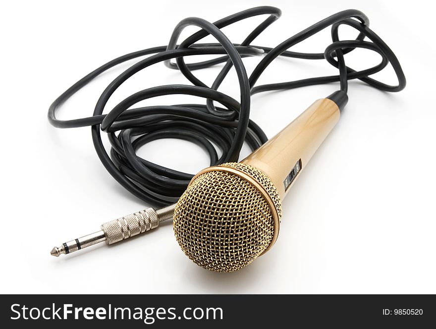 Old golden microphone with a black wire