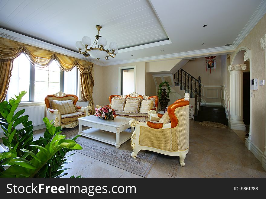 Bright and comfortable living room in a home. Bright and comfortable living room in a home.
