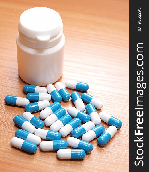 Color photograph of medical pills on the table. Color photograph of medical pills on the table