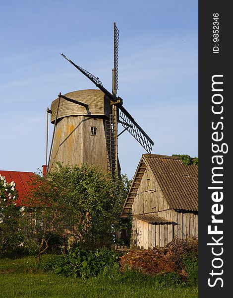 Windmill Behind Houses