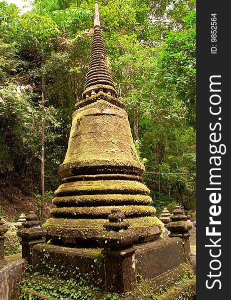 Old pagoda in forest covered with moss, taken in Plew waterfall national park, Jantaburi province, eastern Thailand. Old pagoda in forest covered with moss, taken in Plew waterfall national park, Jantaburi province, eastern Thailand