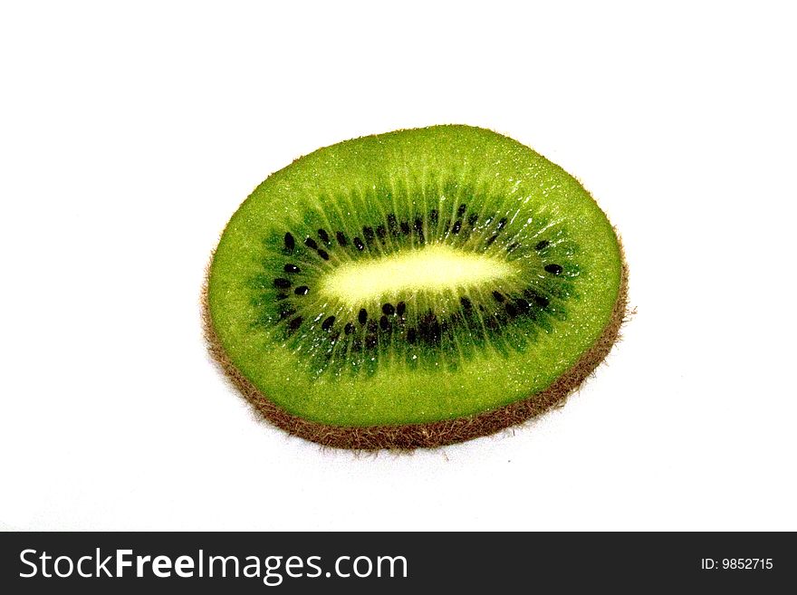 A high contrast shiny sliced kiwi