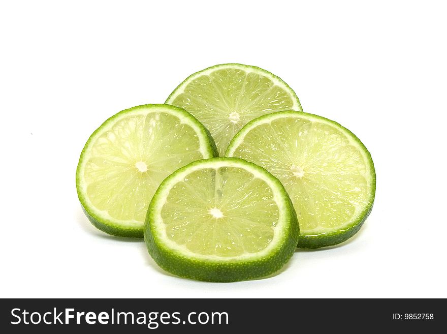 A green shiny sliced lime