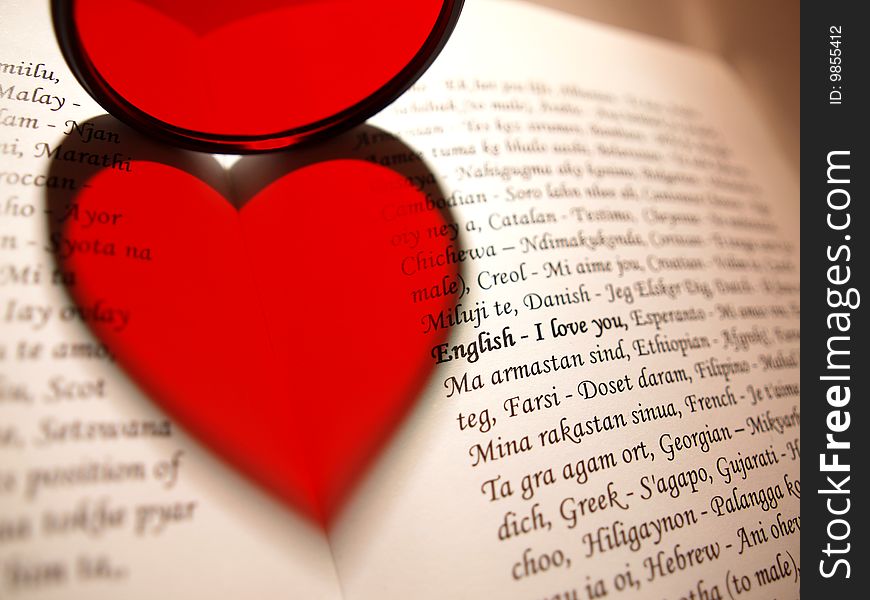 Lens shows a heart-shaped shadow on a book