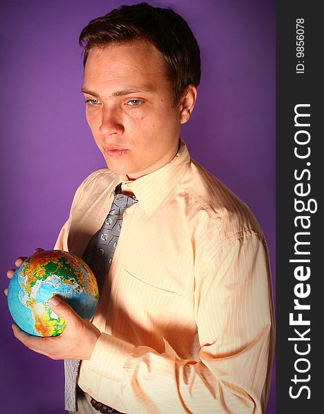 Young businessman standing with globe in his hands. Young businessman standing with globe in his hands