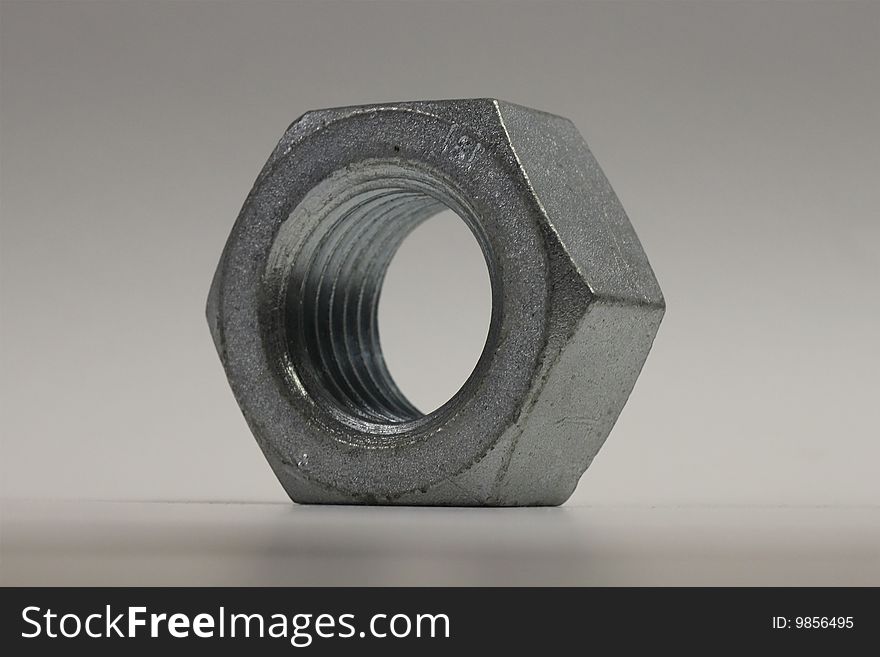 A large zinc plated steel nut. A large zinc plated steel nut.