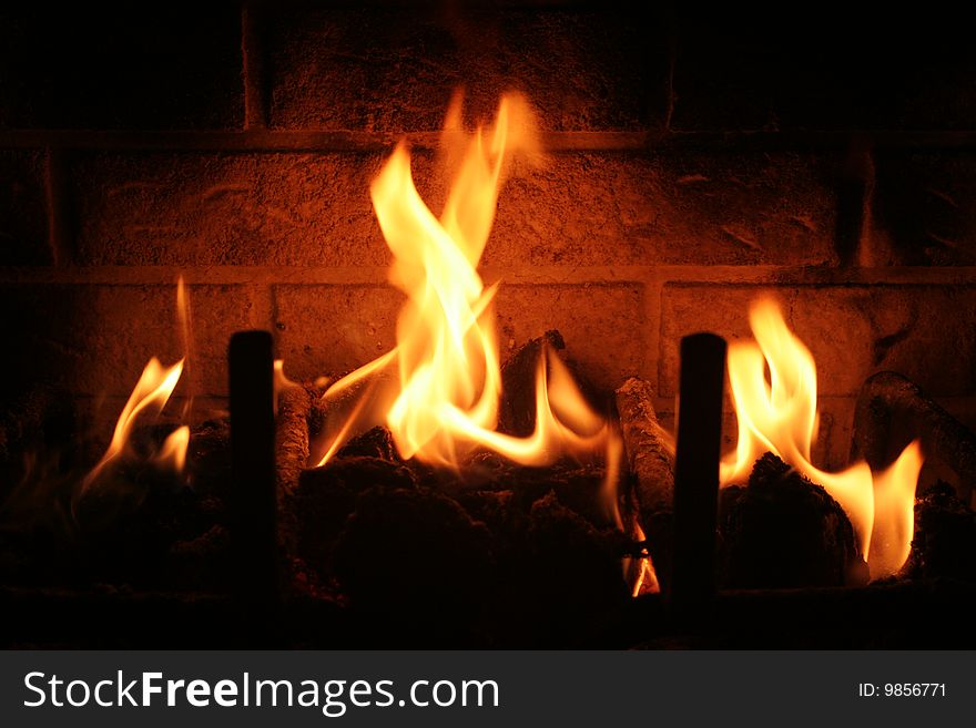 A warm and calming fire burning in a fireplace. A warm and calming fire burning in a fireplace.