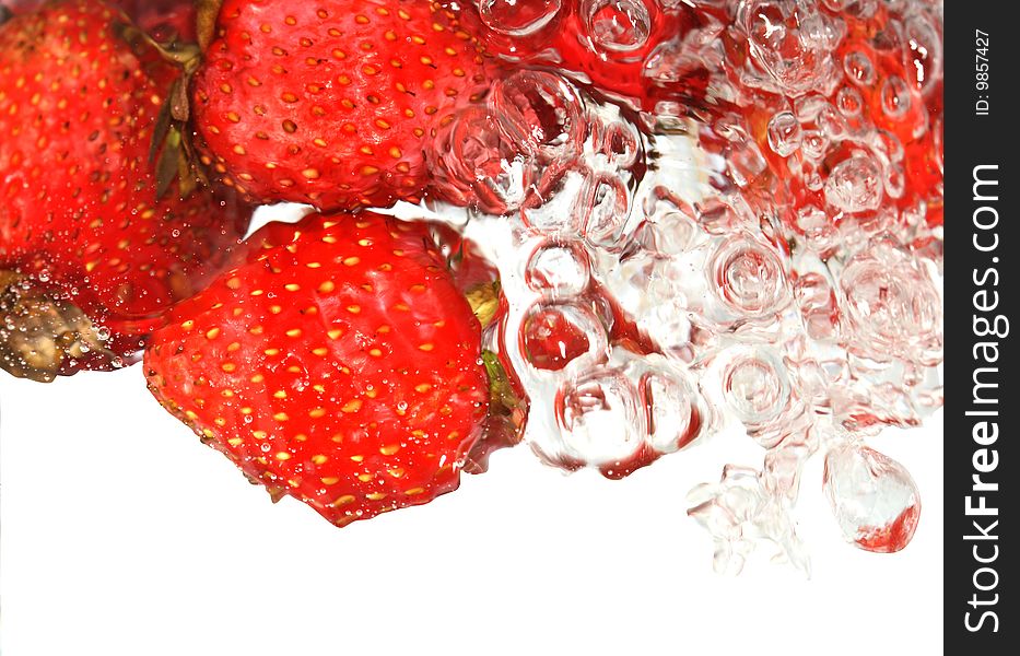 Strawberries on abstract splashing water background isolated with clipping path. Strawberries on abstract splashing water background isolated with clipping path