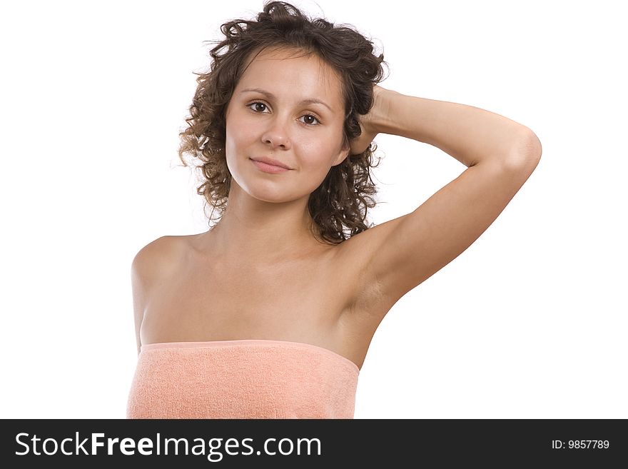 Woman wrapped in a peach-coloured bath towel. girl wearing towel. Isolated on a white background in studio. Young Woman in Bath series Girl in the towel after massage, spa and wellbeing concept. Woman wrapped in a peach-coloured bath towel. girl wearing towel. Isolated on a white background in studio. Young Woman in Bath series Girl in the towel after massage, spa and wellbeing concept.