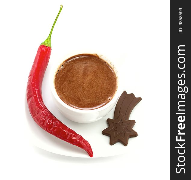 Cappuccino cup with pepper and chocolate on white