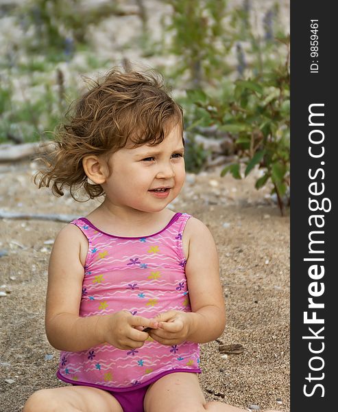 Small girl playing on beach