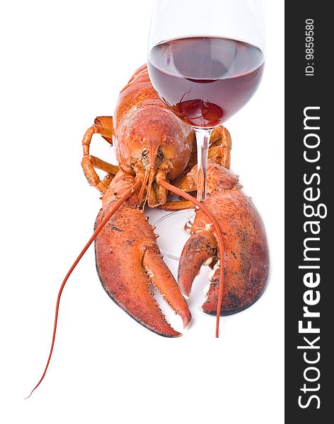 A red lobster holding on a glass of red wine, isolated on white. A red lobster holding on a glass of red wine, isolated on white.