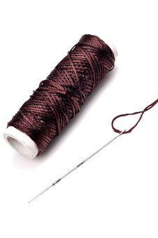 Thread Spindle And Needle Stock Photo
