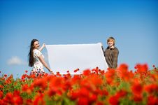 Lovely Couple In The Poppy Field Stock Photos Lovely Couple In The Poppy Field Stock Photos
