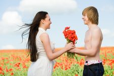 Lovely Couple In The Poppy Field Stock Photography Lovely Couple In The Poppy Field Stock Photography