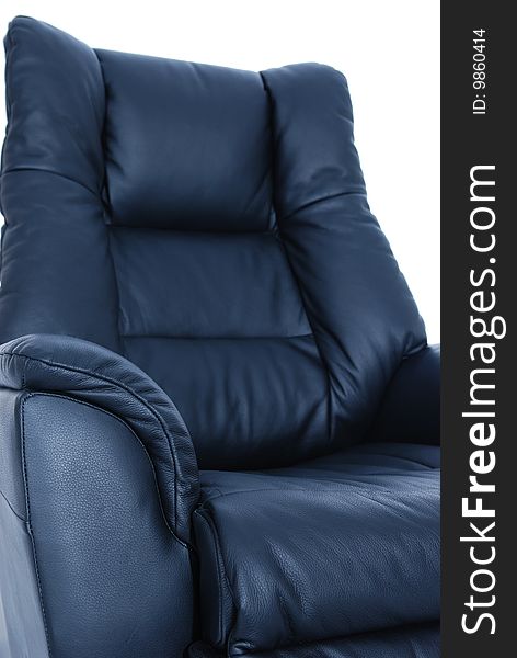 Detail of black leather recliner on white background. Shallow depth of field, with only the nearest parts of the chair in focus.