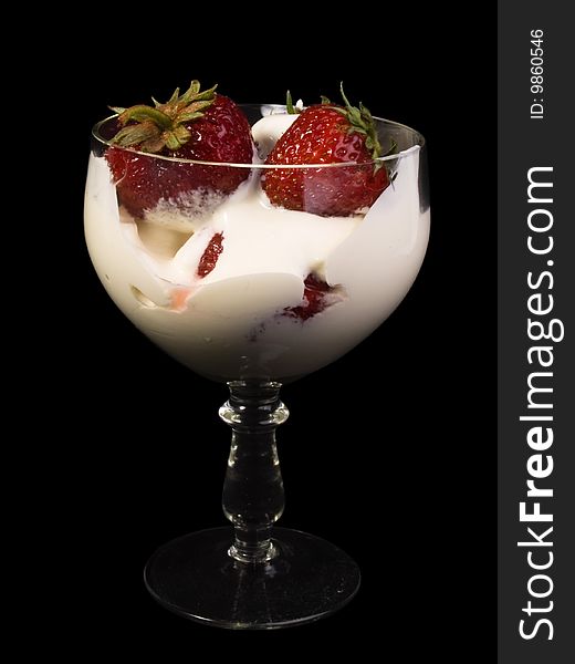 Fresh strawberry with plums in  glass  on a black background. Fresh strawberry with plums in  glass  on a black background