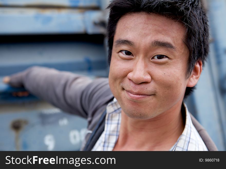 A casual Asian man smiling
