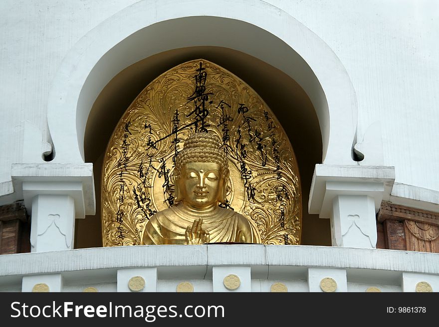 Golden image of Buddha in Buddhist Stupa in Darjeeling, West Bengal, India, Asia